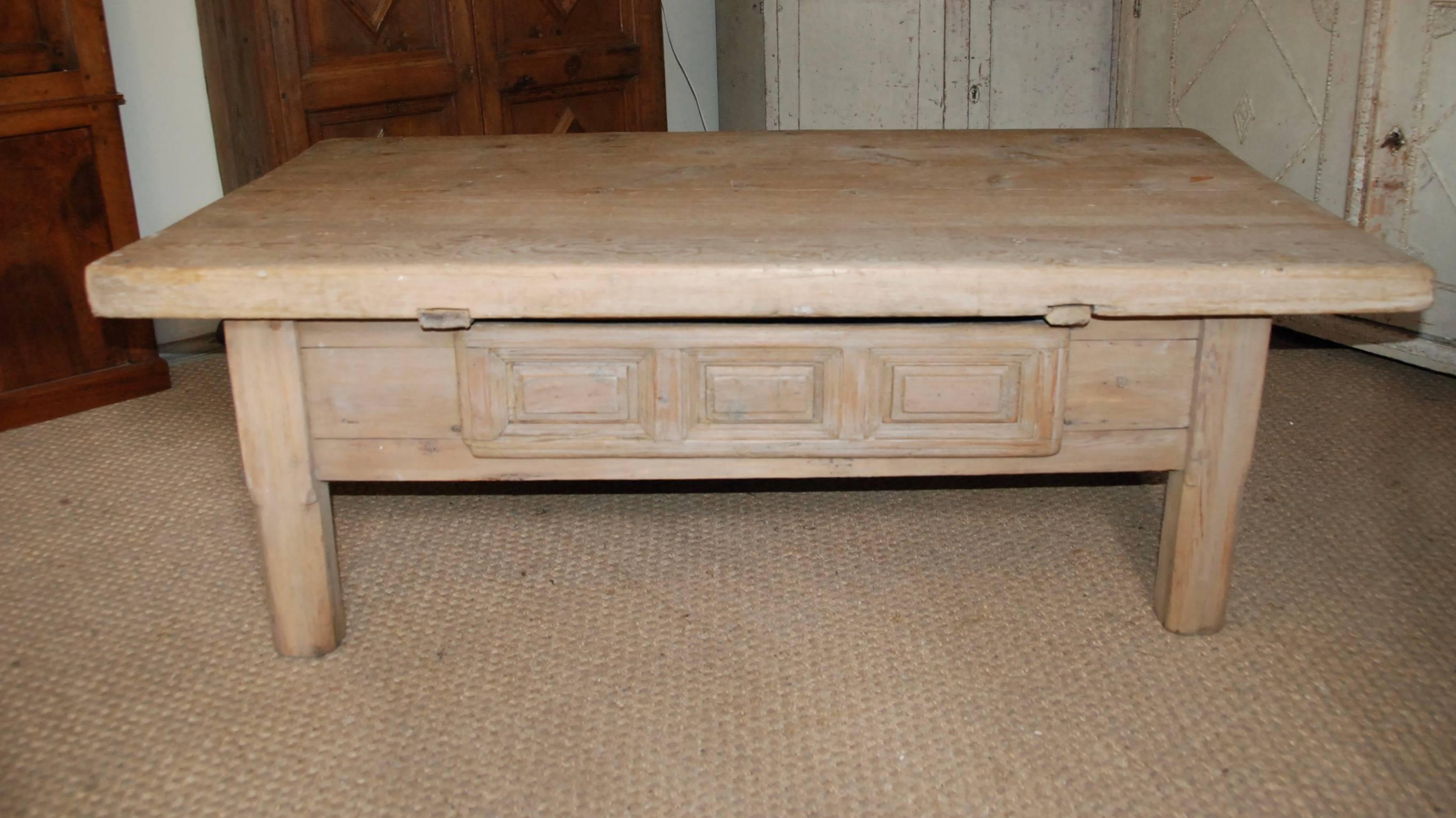 18th century Swedish pine farm table cut down to make a lovely coffee table. One large carved paneled drawer on front side. Beautiful thick single plank top. Great aged patina.