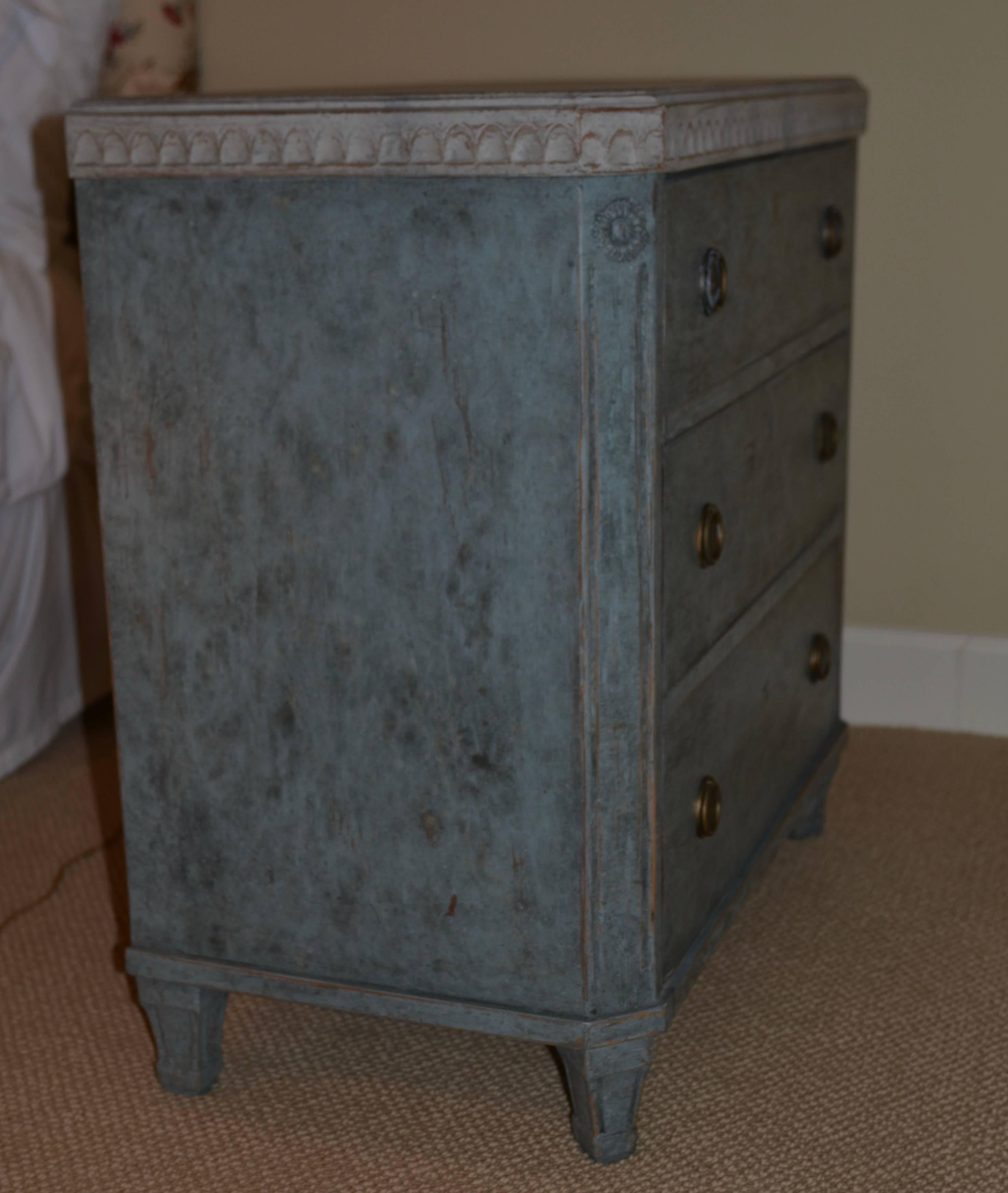 Pair of antique Swedish Gustavian painted chests in lovely blue paint with carved border around beautiful faux grey marbled top. Classic square tapered legs, brass hardware and raised panel detail. 