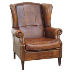 Chaise à oreilles en peau de mouton en bon état