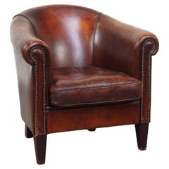Fauteuil club en cuir de mouton de couleur cognac