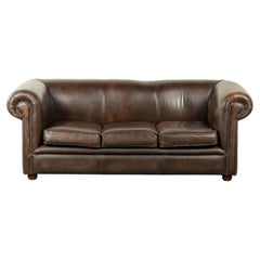 Luxury brown smooth cow leather Chesterfield sofa with an English look