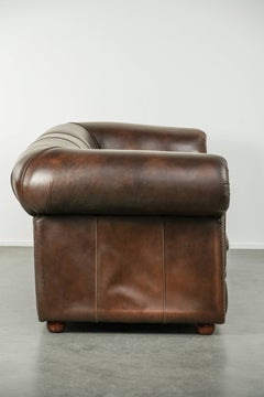 Luxury brown smooth cow leather Chesterfield sofa with an English look