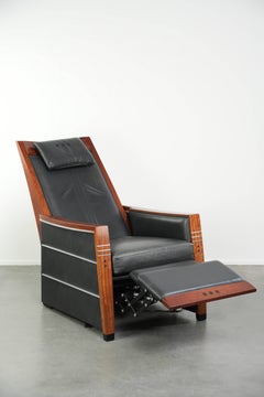 Electrically adjustable Art Deco design recliner with black cowhide leather