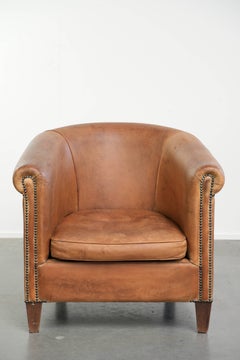 Vintage sheepskin club armchair in a beautiful light cognac colour