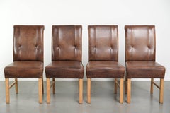Set of 4 large model sheepskin dining chairs in a dark cognac colour