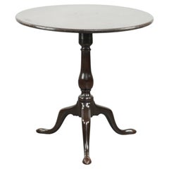 Practical round antique English tilt top table from the 18th century