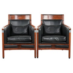 Set of 2 black leather Art Deco design armchairs in good condition