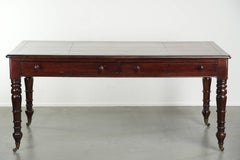 Antique English writing desk from the late 19th century with a warm colour
