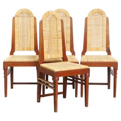 Set of four rattan Art Deco design dining chairs with high back