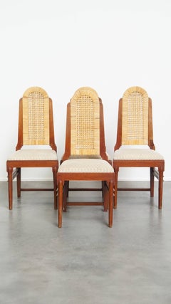 Set of four rattan Art Deco design dining chairs with high back
