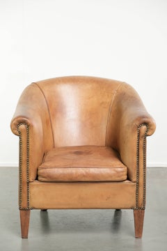 Fauteuil club confortable en peau de mouton, couleur cognac