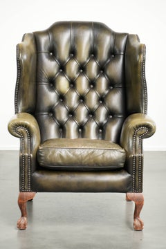 Vintage cowhide leather Chesterfield wingback armchair in a green colour