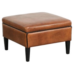 Versatile sheepskin ottoman/footstool in a warm cognac colour