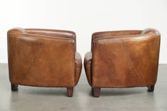 Set of two vintage cowhide Aviator design armchairs in grained leather