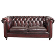 Luxurious cow leather Chesterfield 2.5-seater sofa in oxblood red