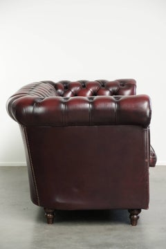 Luxurious cow leather Chesterfield 2.5-seater sofa in oxblood red