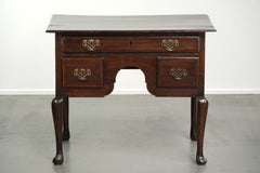 Elegant 18th-century English oak lowboy with a luxurious appearance