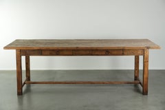 Large antique farmhouse dining table from the 19th century made of pinewood