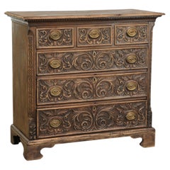 Richly carved English oak chest of drawers from the 18th century