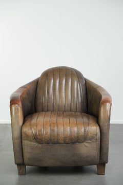Fauteuil club robuste de style aviateur, en cuir de vachette, doté d'une finition en aluminium unique