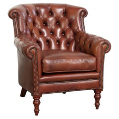 Poltrona Chesterfield in pelle di vacchetta color cognac, in stile inglese