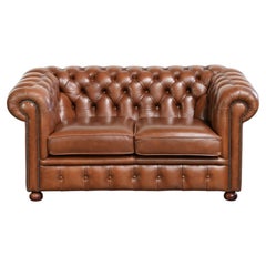 Very spacious 2-seater Chesterfield sofa in cow leather in a English look