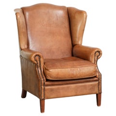 Sessel mit Flügellehnen aus Schafsleder in hellem Cognac-Farbton im englischen Stil