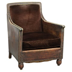 Art Deco design armchair finished in velvet and fitted with decorative nails
