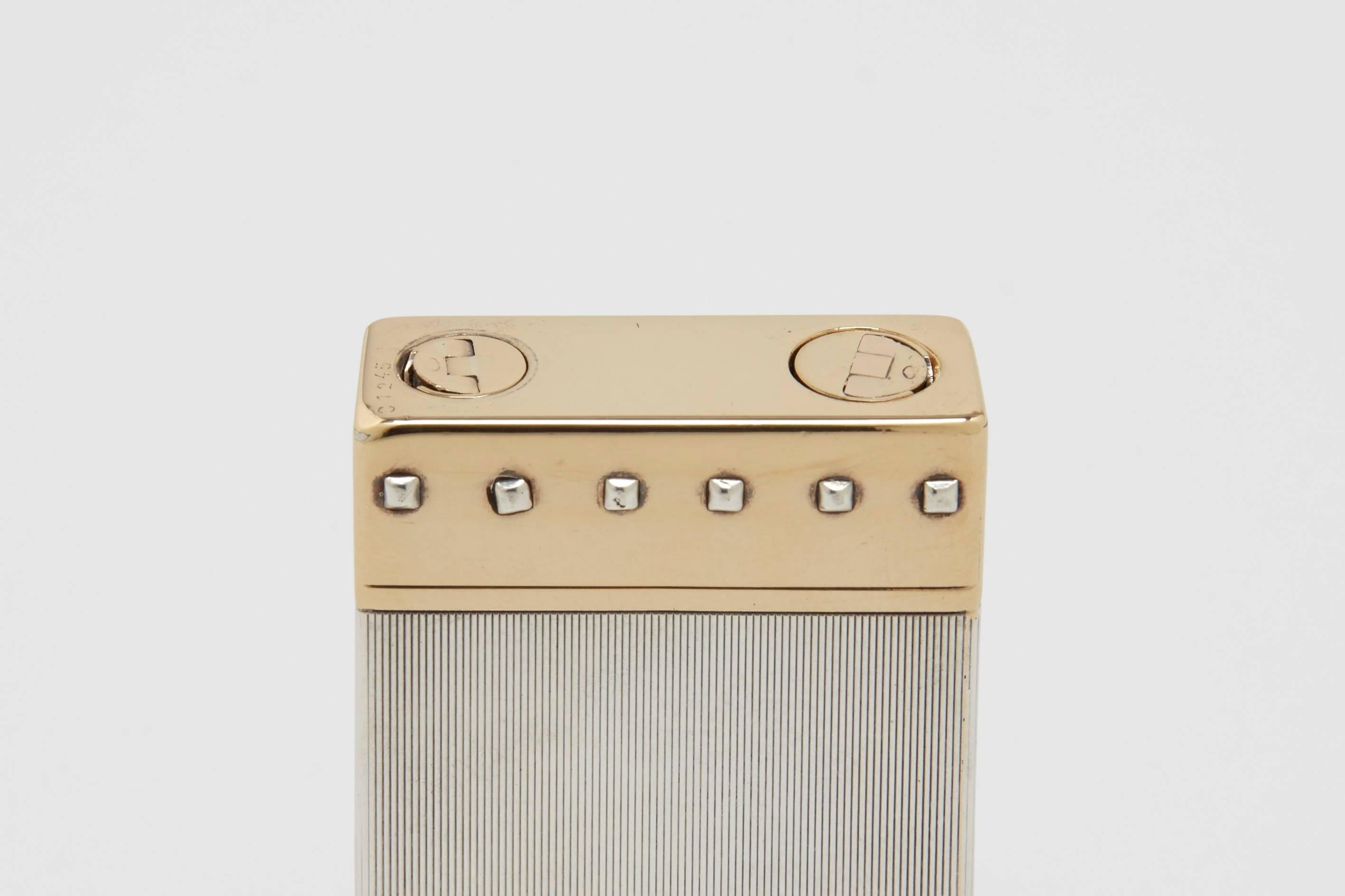 A very rare Art Deco sterling silver and solid 18-carat gold petrol wick lighter. This is a unique prototype or special order lighter from Cartier, as was sometimes the case during this period where wealthy and famous clients would work with the
