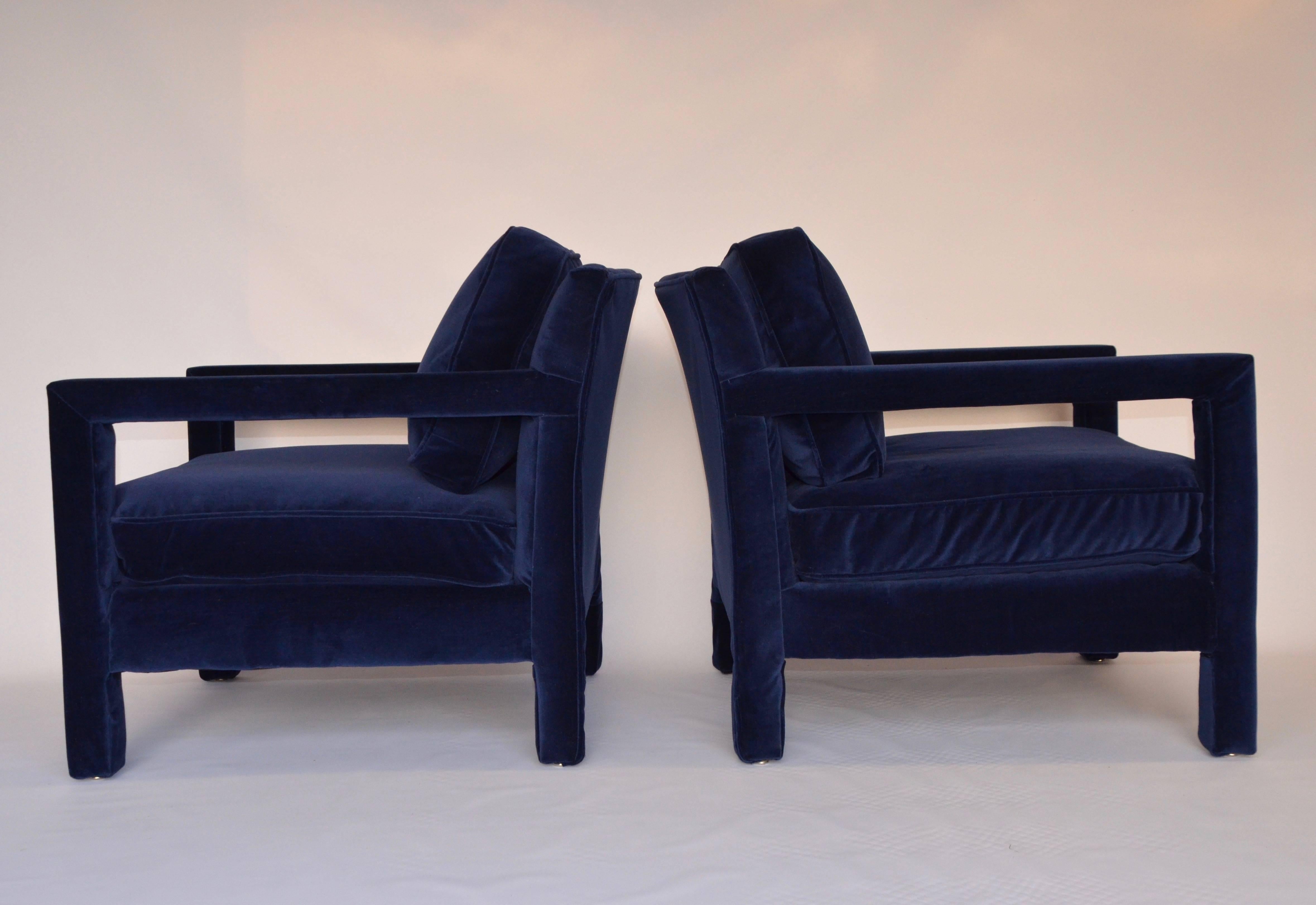 A beautiful pair of fully upholstered Parsons chairs in the style of Milo Baughman.  The chairs have been newly upholstered in a high quality blue velvet. Each chair has a removable back and seat cushion. Extremely comfortable.  Made by Bernhardt
