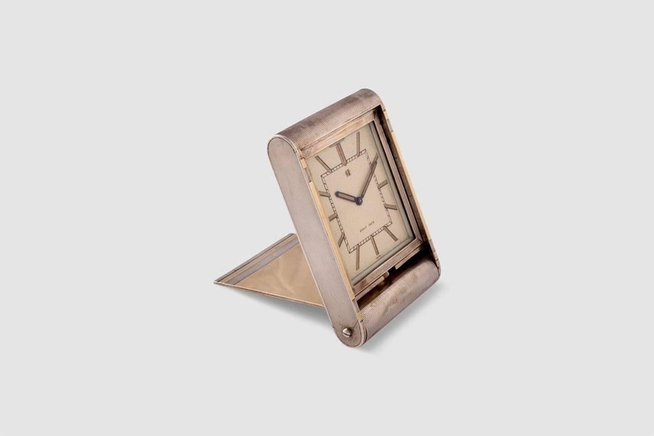 An exceptional and very rare sterling silver and gold-plated mechanical travel clock. This folding desk travel clock was a very popular design for Jaeger LeCoultre, and the company made this model for a number of the world's leading retailers of the