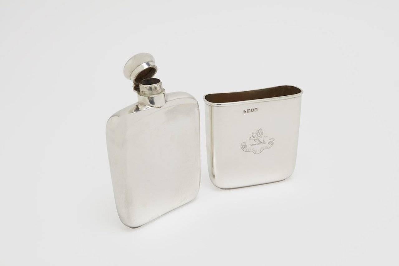 A sterling silver travel drinking flask with large removable drinking cup. This is a stunning piece, very simple in design, however, what makes this flask unusual is the large, thick gauge, removable drinking cup that slides off the main body of the