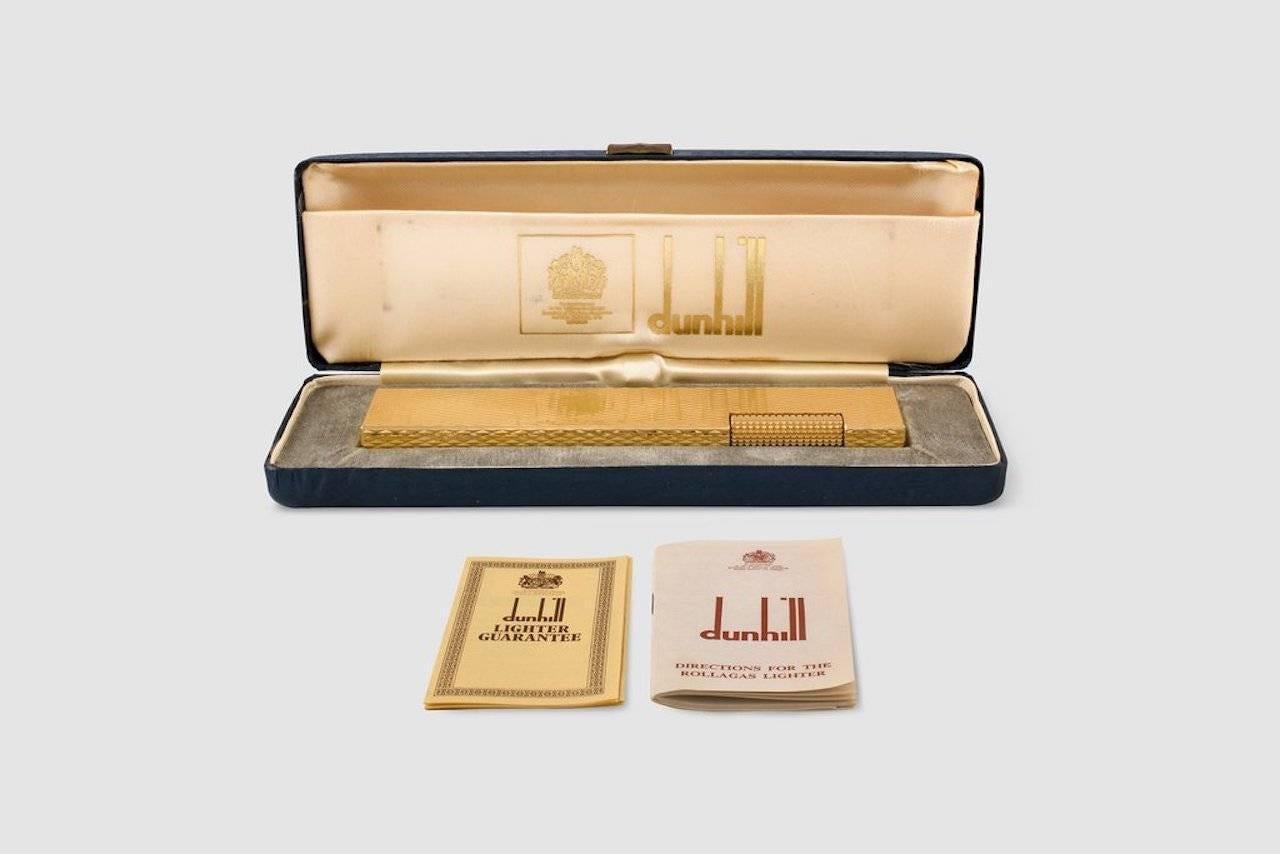 A large, gold-plated, engine turned, table lighter made by the best known luxury retailer of smoking accessories; Dunhill. Alfred Dunhill took over his father's saddlery business in London, Henry's, and turned it into one of the finest destinations