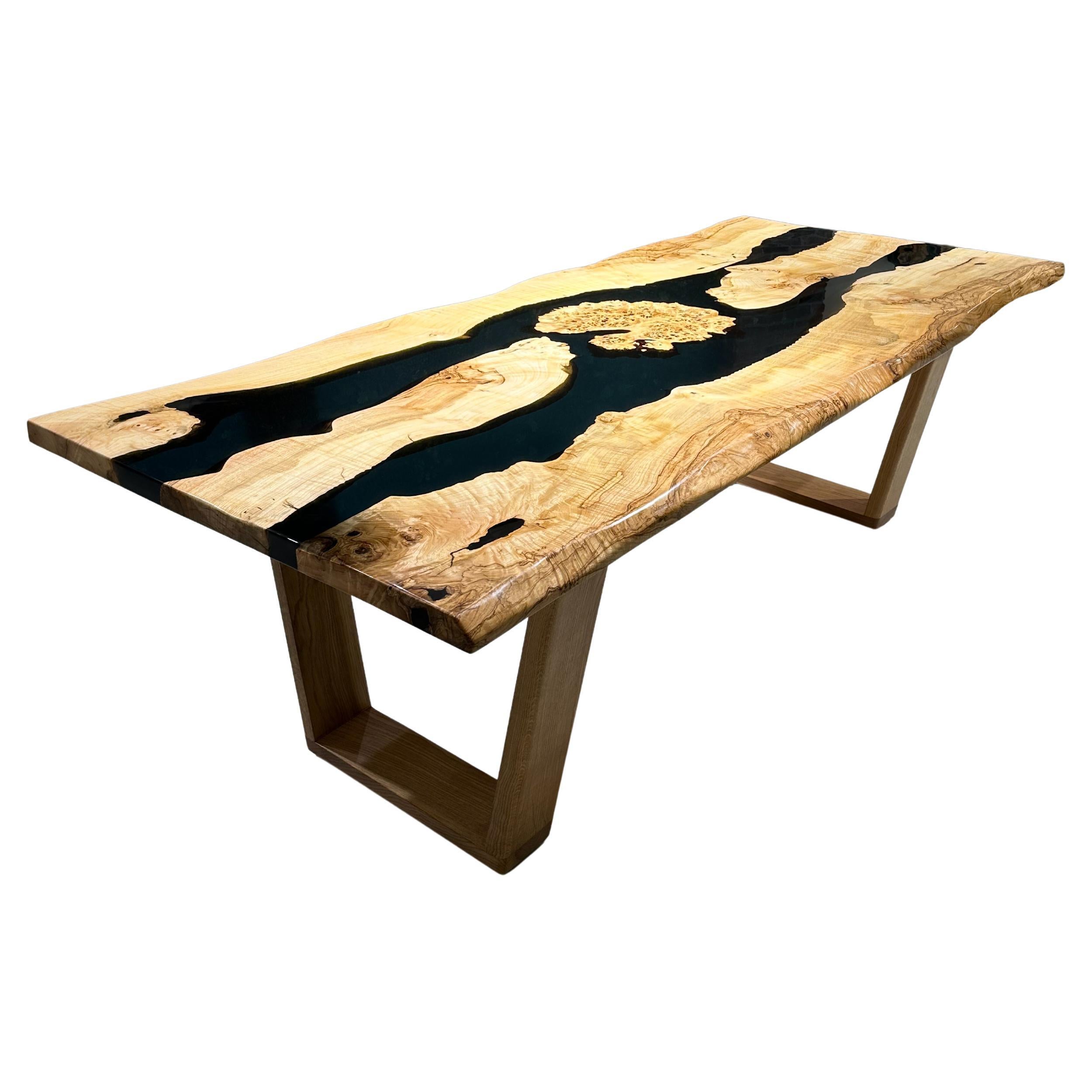 Ash Wood GREEN EPOXY RESIN DINING TABLE

This epoxy table emerges as a unique work of art, inspired by nature's beauty. 

The epoxy table stands out not only for its design but also its durability. Thanks to its epoxy coating, it is highly resistant