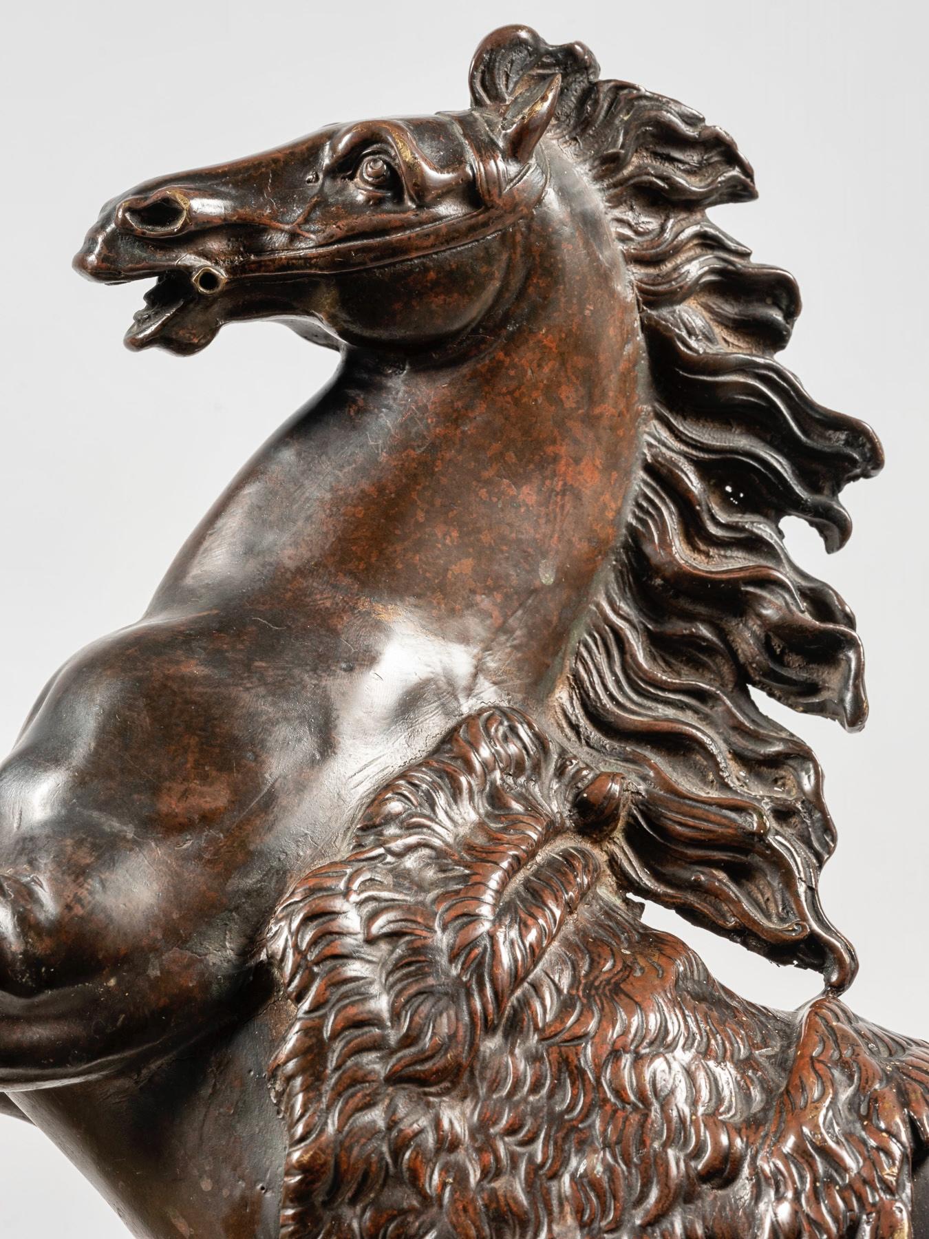 Mid-19th Century Pair of Patinated and Ormolu Mounted Horse Model Chenets, After Jacques Caffieri For Sale