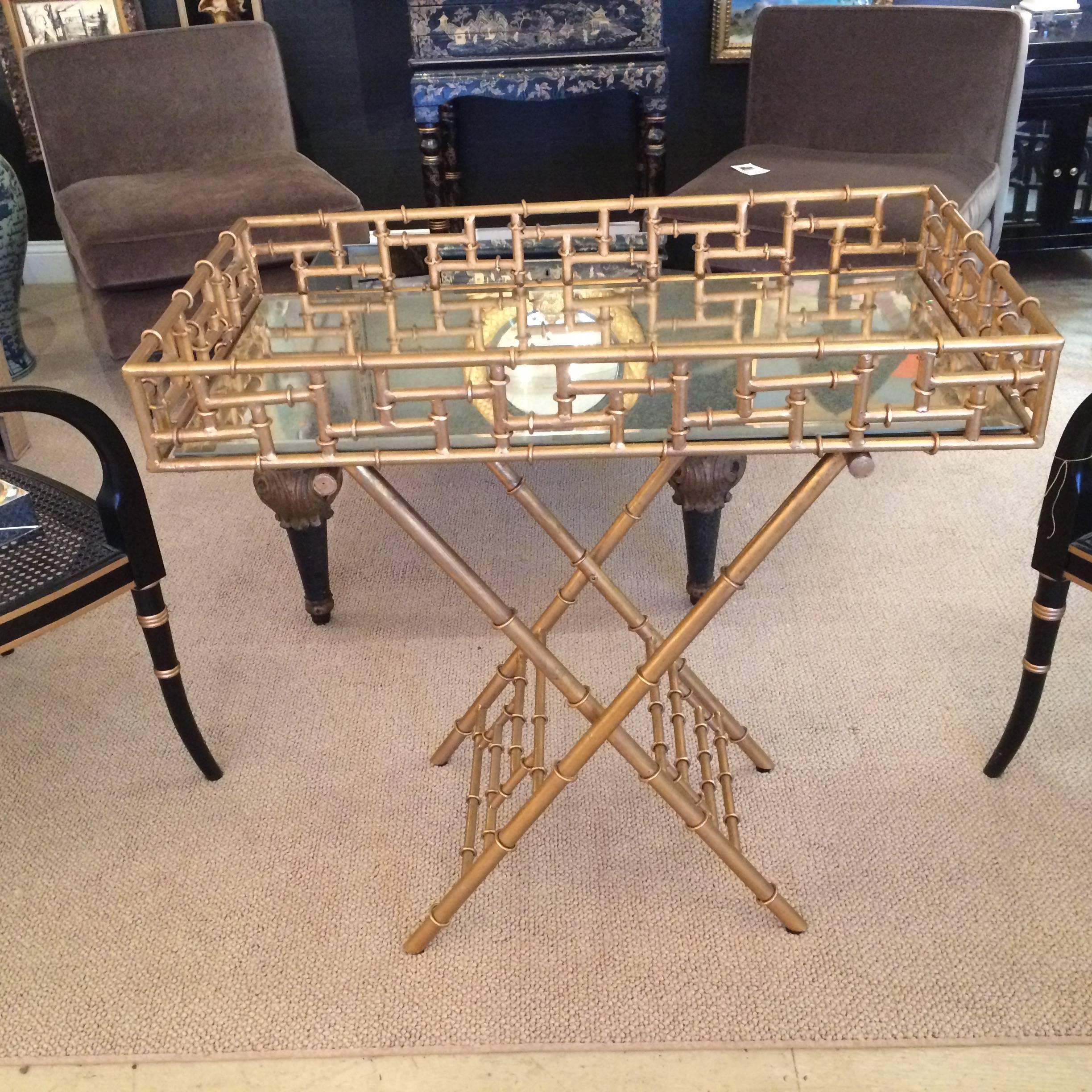 Sophisticated gilded metal faux bamboo tray top bar that rests on elegant X-style base. Tray top has antiqued mirror surface.