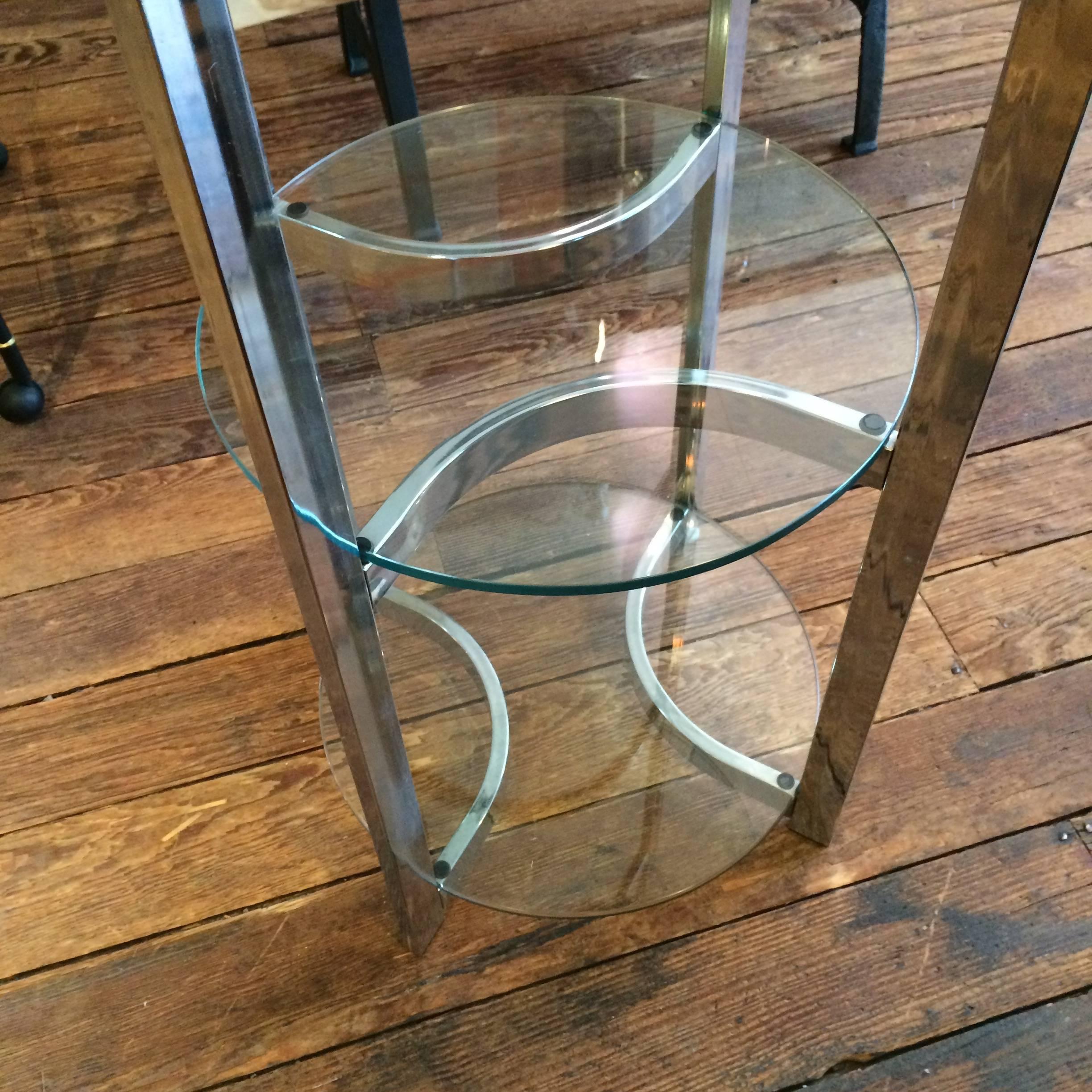 Fabulous circular etagere with chrome form and five round glass shelves.

SC