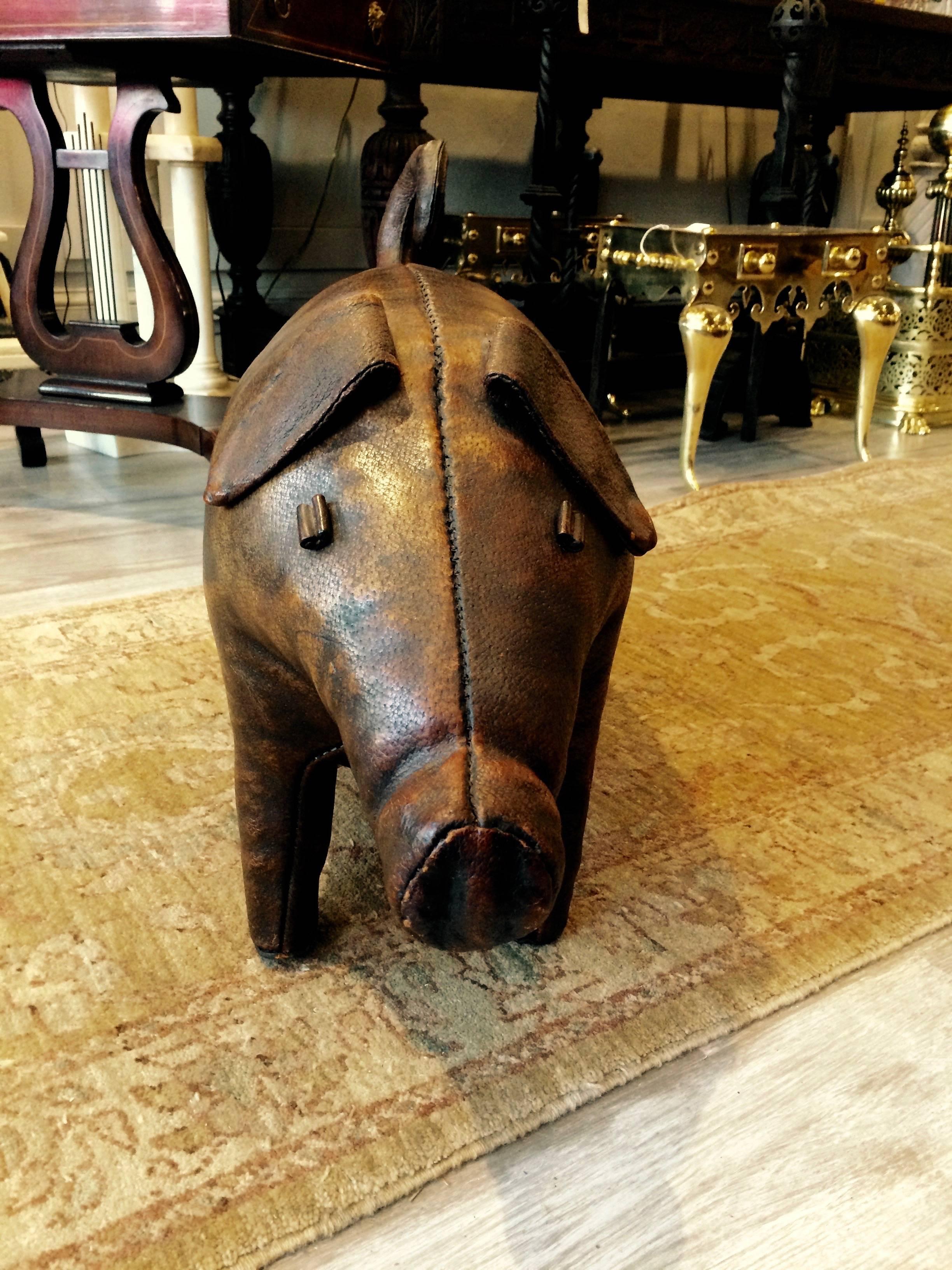 Whimsical leather pig designed by Dimitri Omersa for Abercrombie and Fitch in the 1960s. From a collection of leather animals that were meant to be used as ottomans and foot stools. Rich aged patina in great condition.