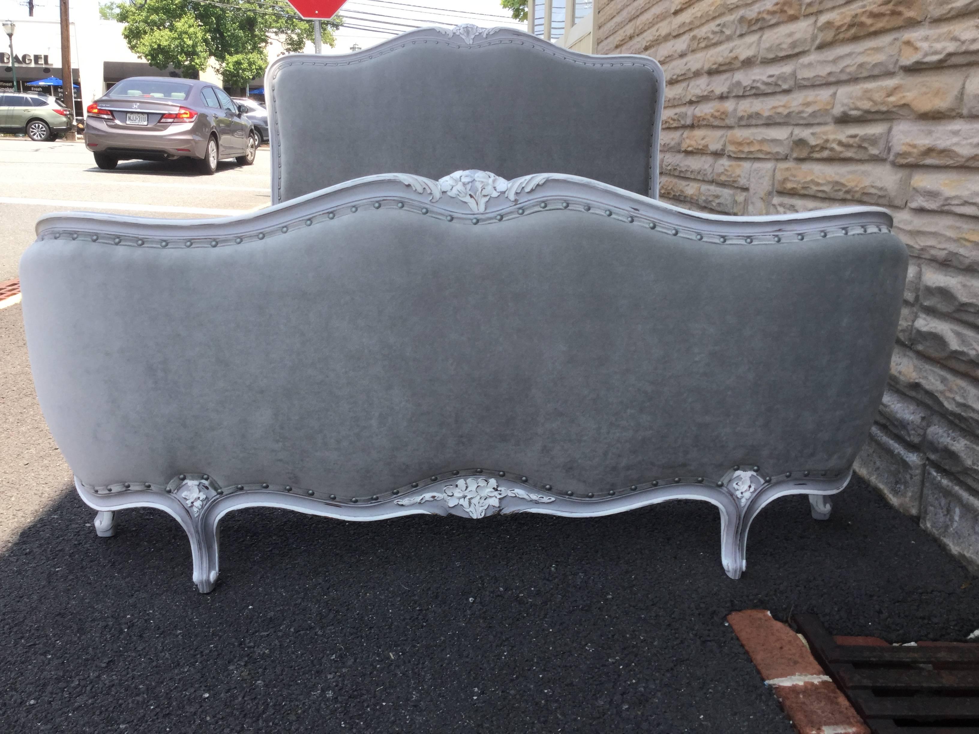 Louis XV style full-size bed custom painted French dove gray with white
accents. Carvings on the headboard and footboard are highlighted in white.
The elegant footboard is upholstered on both exterior and interior and
features a rounded design.