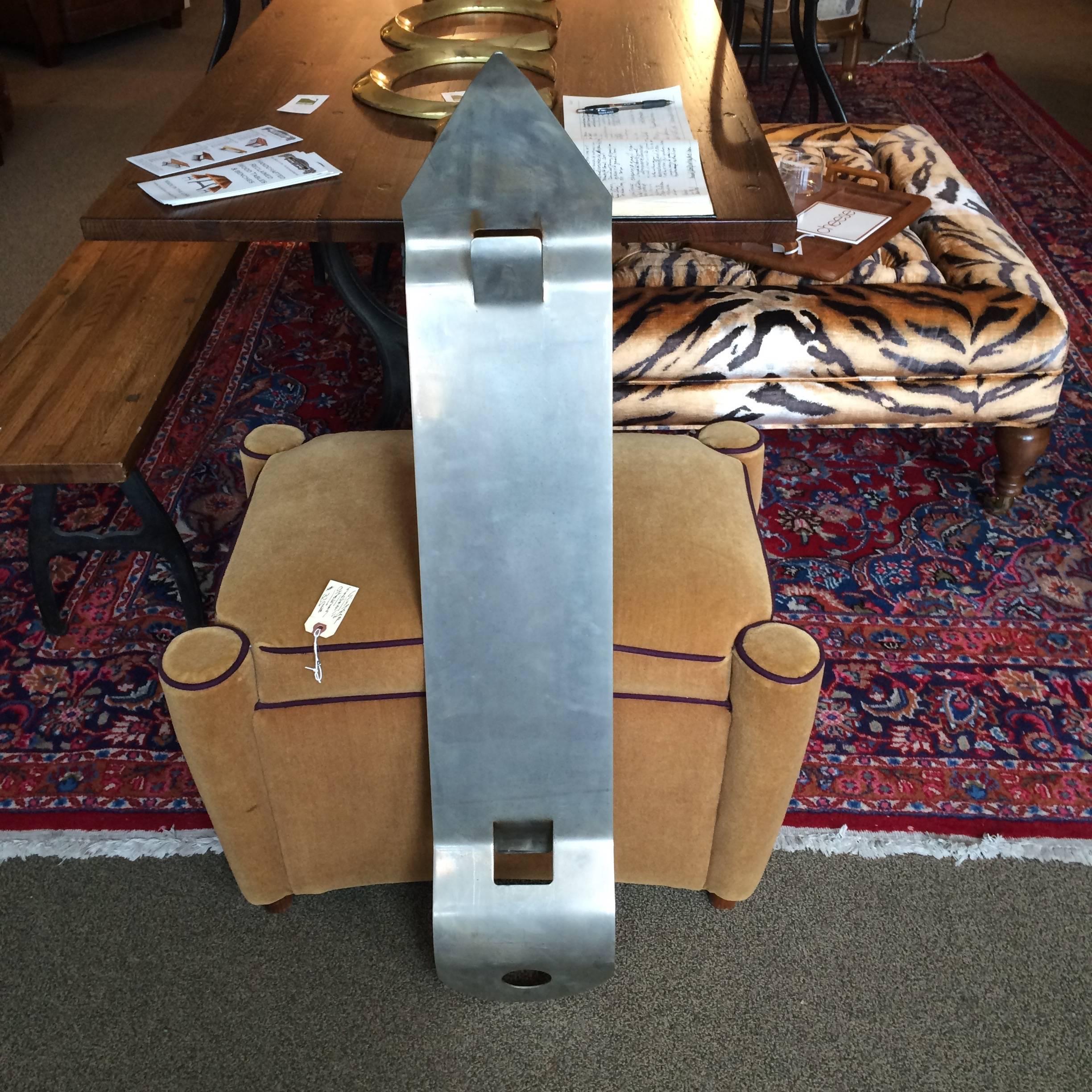 Fun super-sized can opener sculpture.