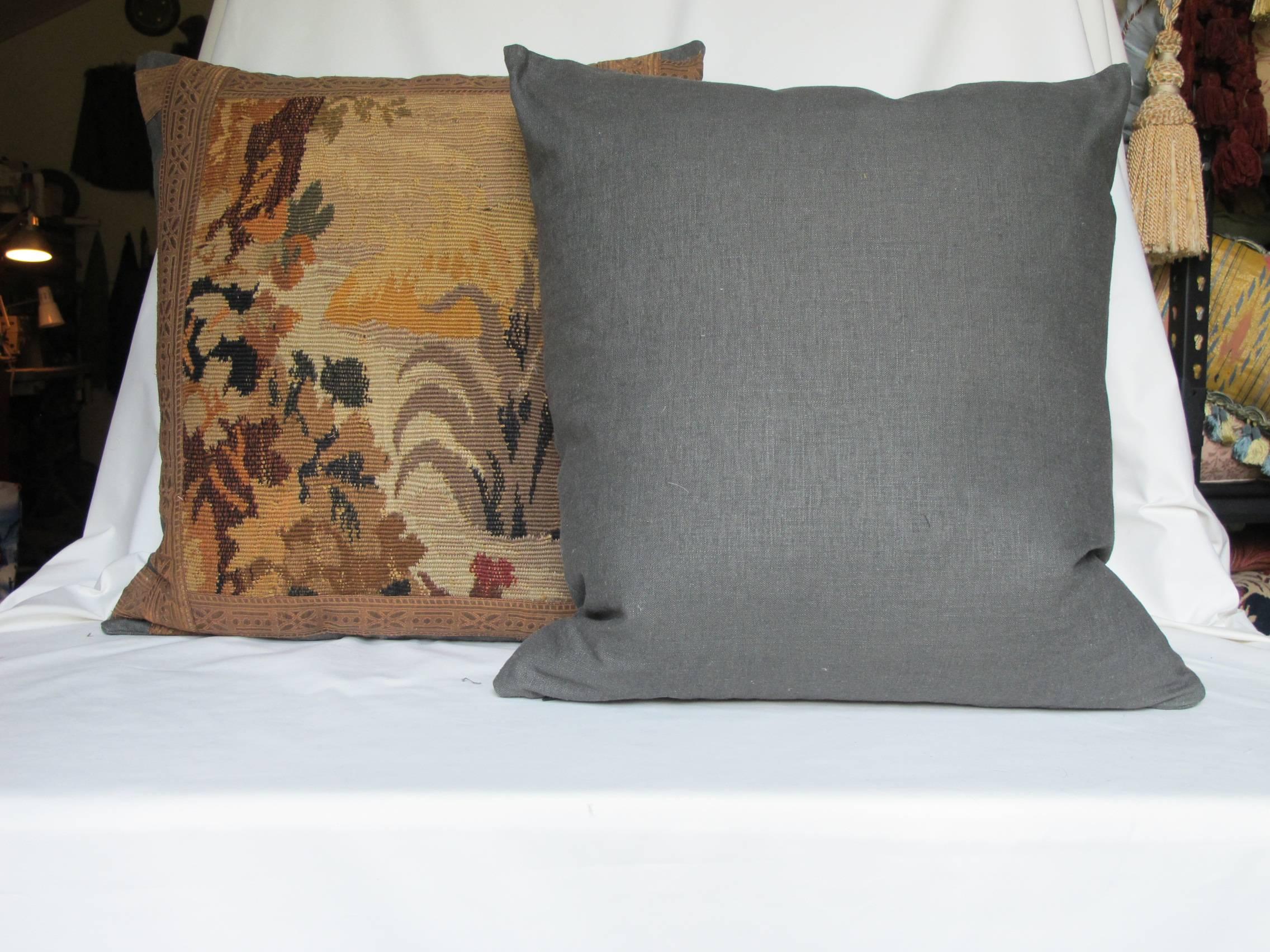 Pillows made from a circa 1860s French Aubusson weave tapestry fragment, depicting foliage and a bird.
Edged and backed with coordinating Belgian linen and embellished with antique metallic trim, with a hidden zipper closure, down inserts