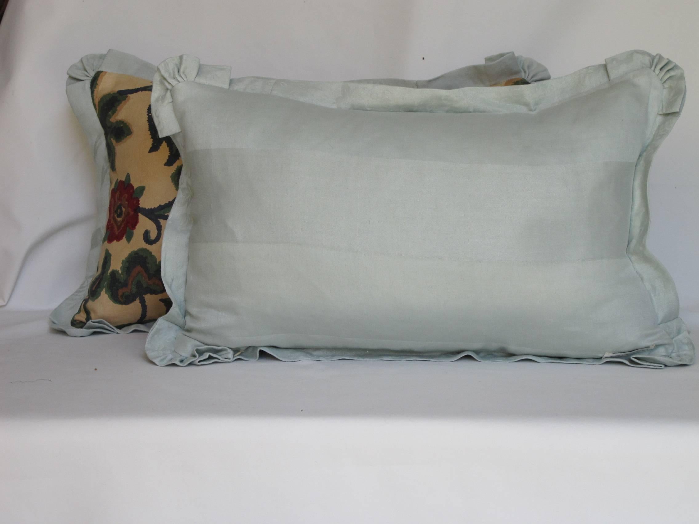 A pair of pillows made from a circa 1920s printed linen with an indienne floral motif, in shades of blue, green and cream, edged and backed with hand-dyed linen damask. Hidden zipper closure, down inserts included.
 