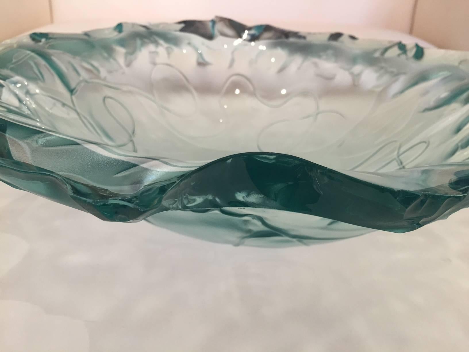 Heavy greenish tinted art glass bowl with beautiful irregular scalloped edges, signed by artist.