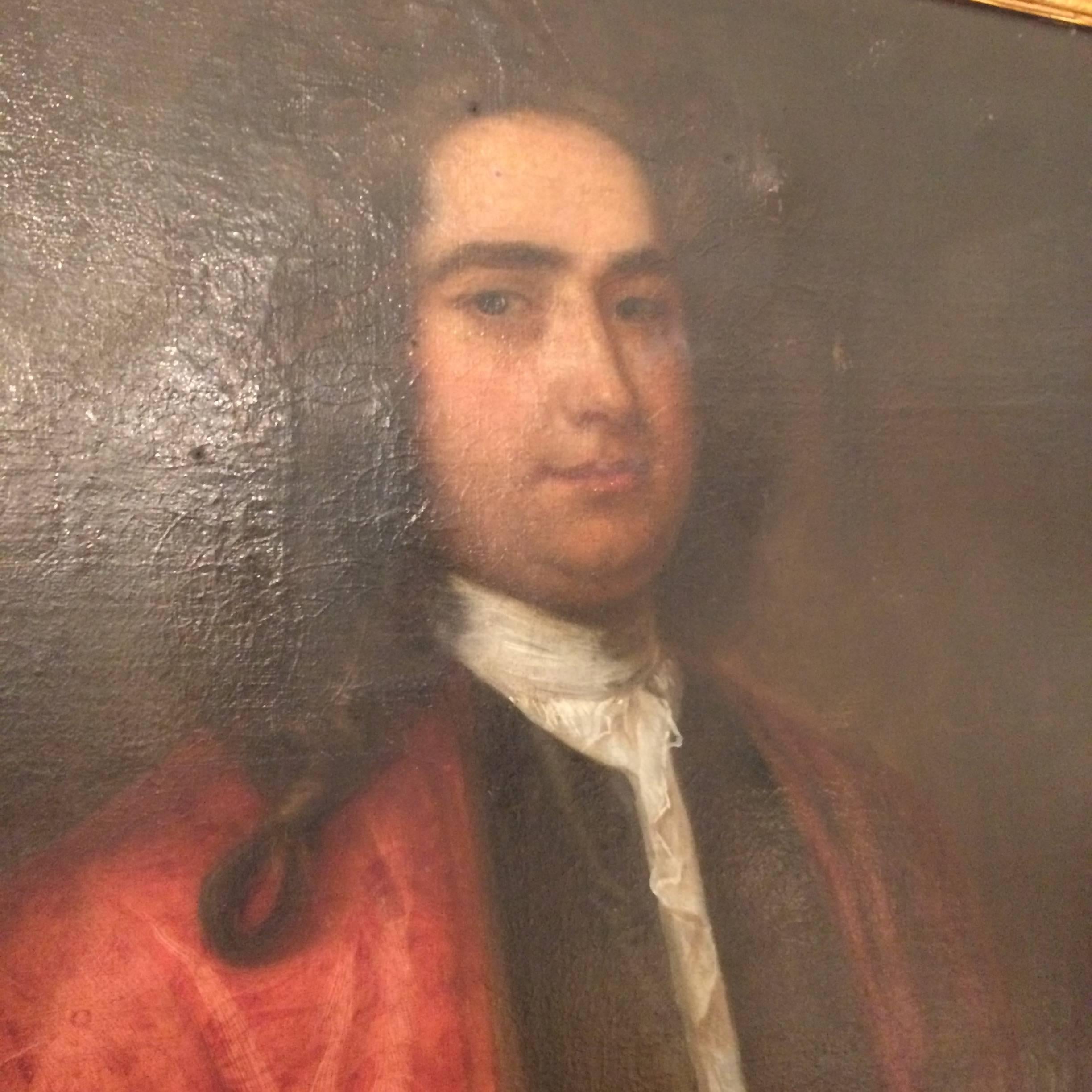Large oil on canvas of an aristocratic Englishman with one hand tucked into his smoking jacket, the other leafing through letters. Gorgeous red oxide and gilded frame. Artist unknown.