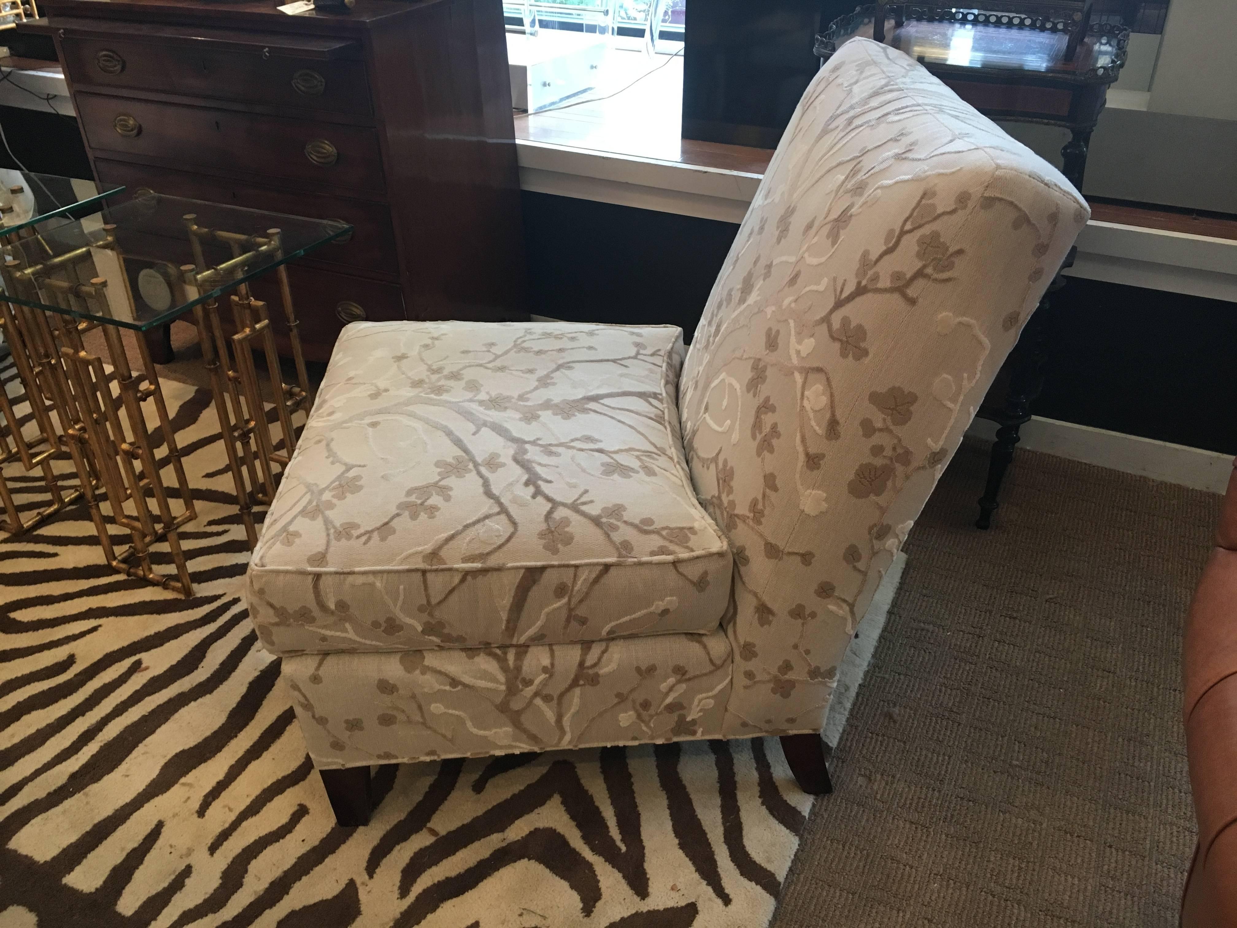 Sophisticated pair of slipper chairs in cherry blossom inspired fabric in shades of beige, taupe and white. Ebonized feet. Seat height 18