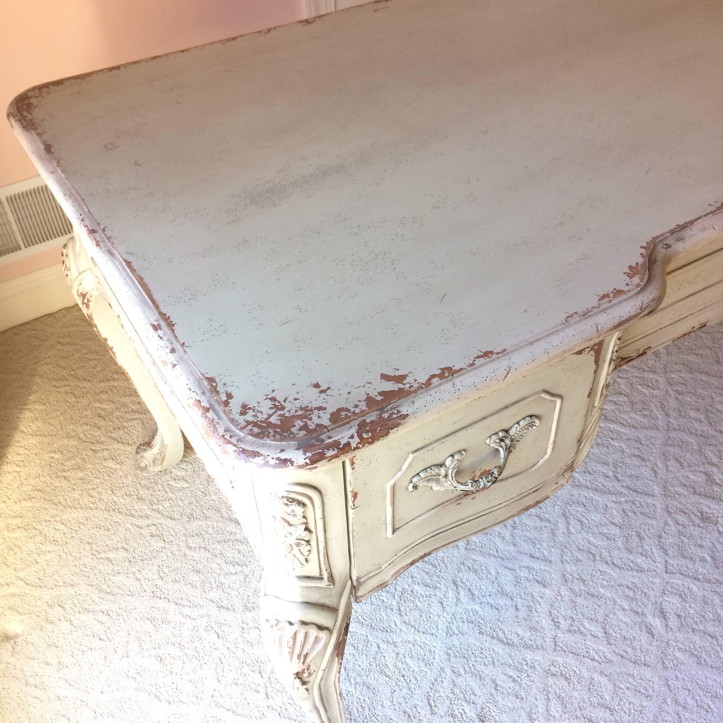Lovely Habersham La Maison desk having a painted wood antiqued soft greyish green finish, with three drawers and carved wood cabriole legs. Beautiful and finished on the back too, so can be floated with every angle visible. 

LSilver.
