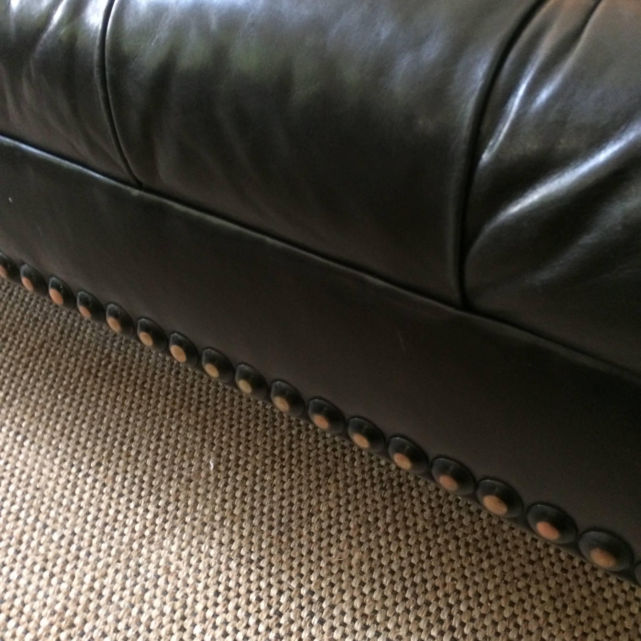 black tufted leather sofa