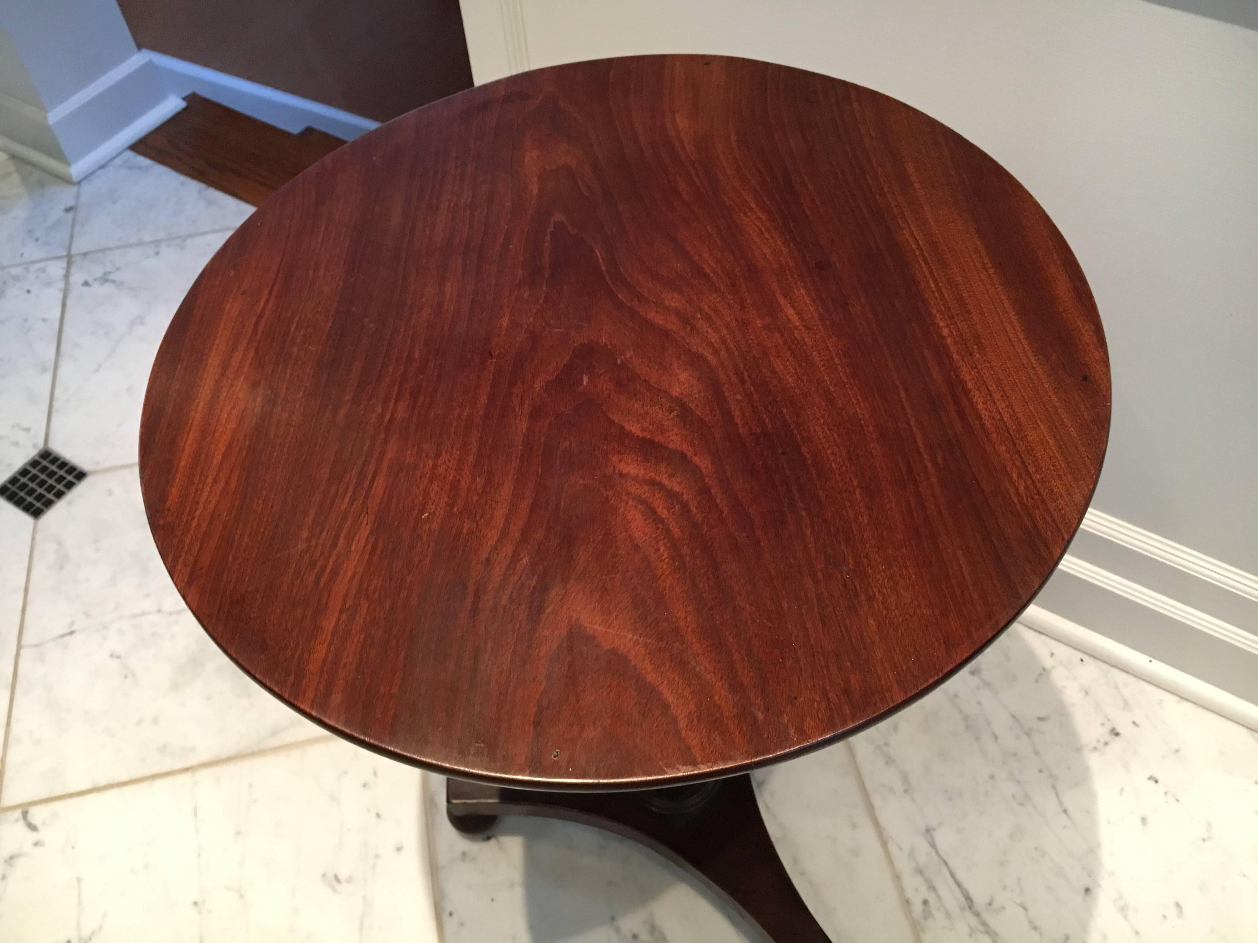 Handsome English mahogany tilt-top side table with tripod base on ball feet. Tripod base is 16.25" wide. Table height is 40" when opened upright.