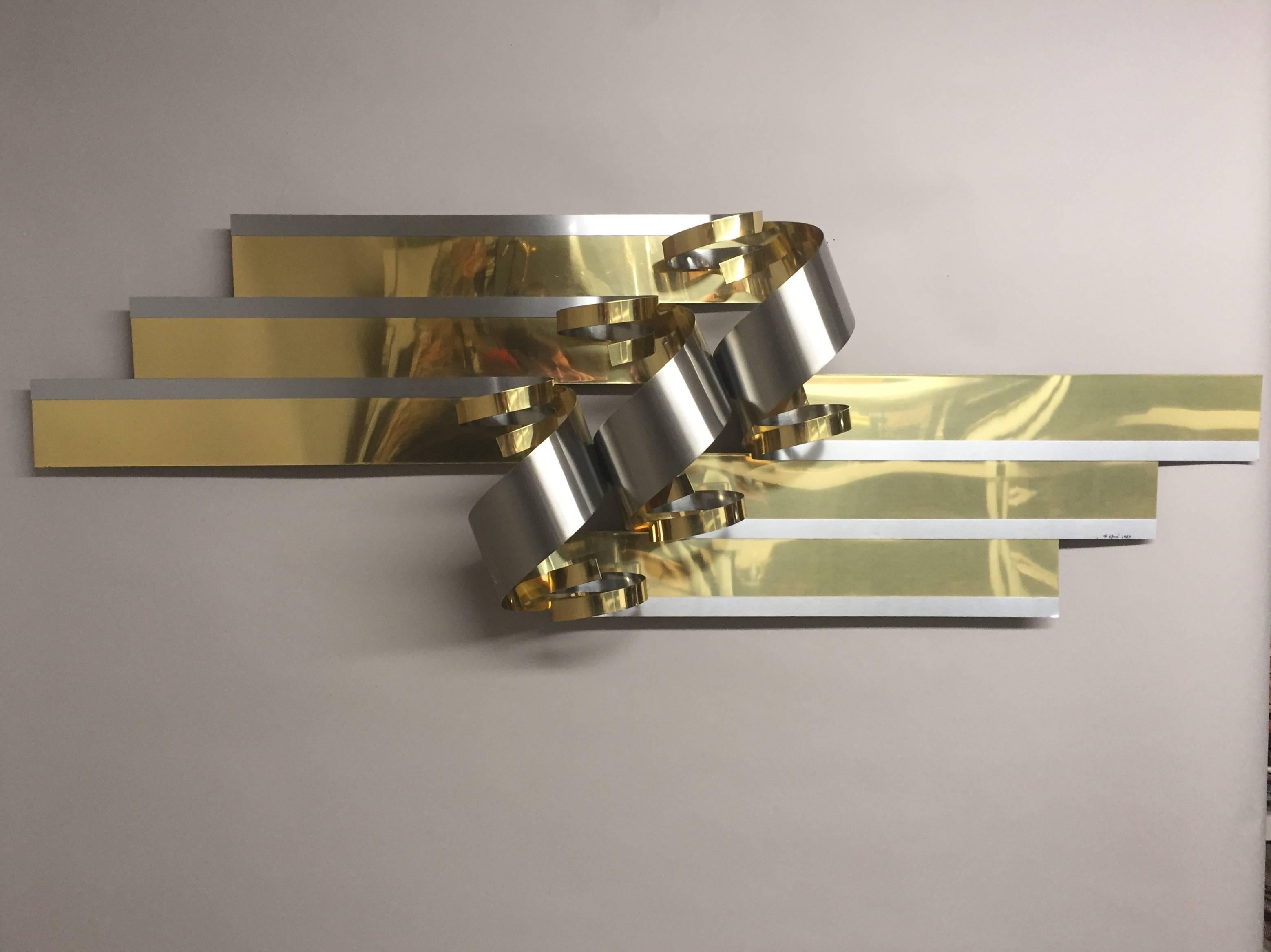 Eye-catching large ribbon motif Curtis Jere signed brass and chrome modernist sculpture that can be hanged horizontally or vertically.