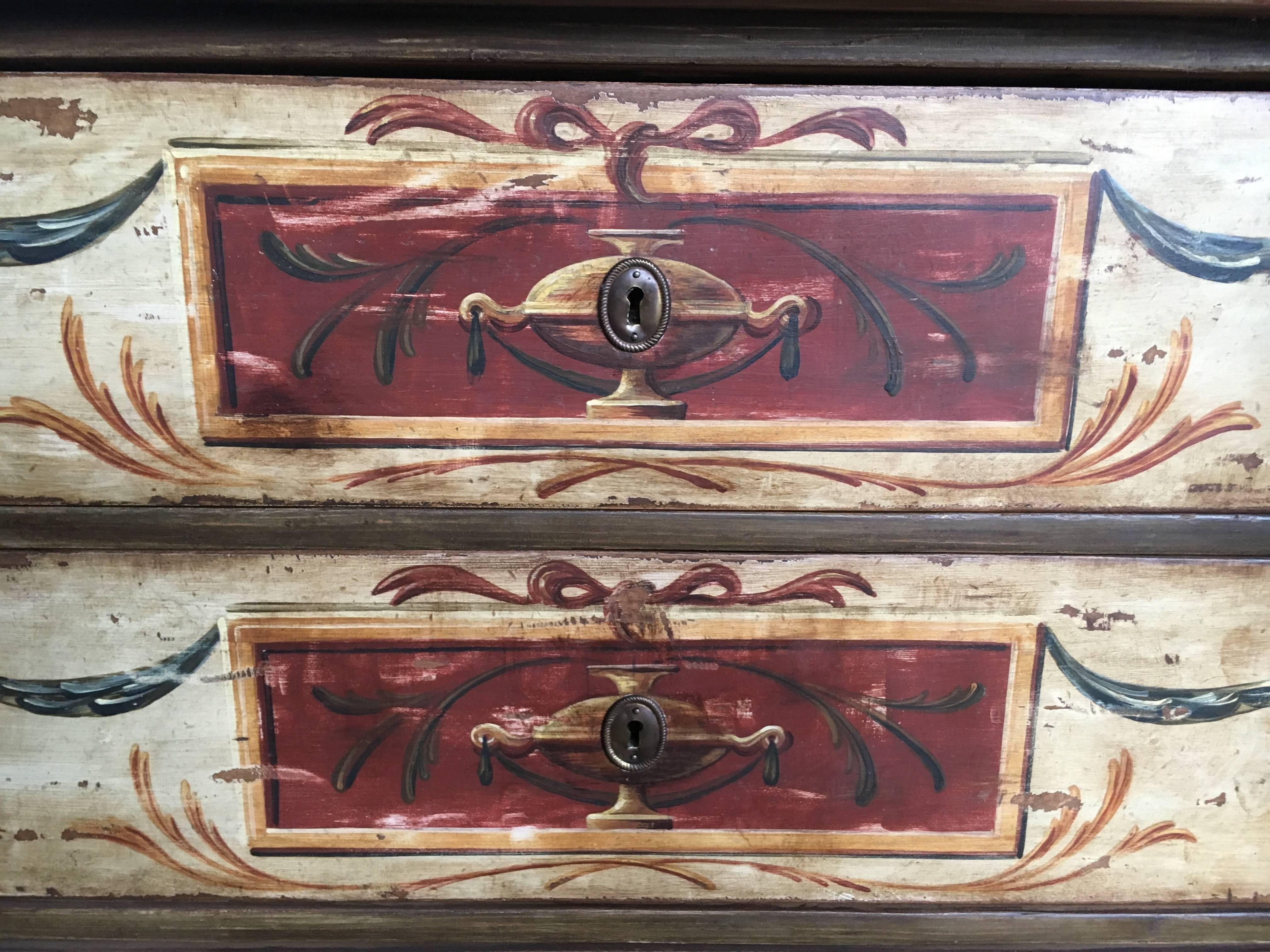 Charming antique florentine style paint decorated chest having three pull-out drawers. Mid-19th century with later paint.